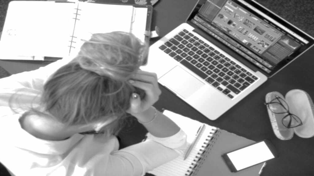 Woman Sitting in Front of Macbook